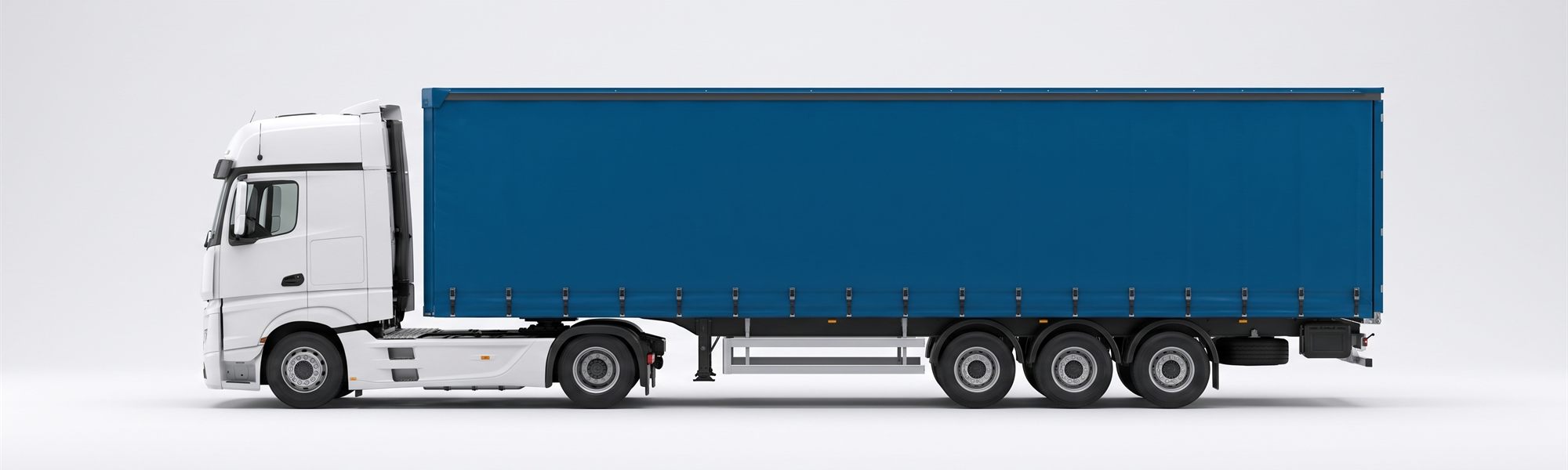 Curtainsider: Sattelzug mit blauem Planenauflieger in Seitenansicht